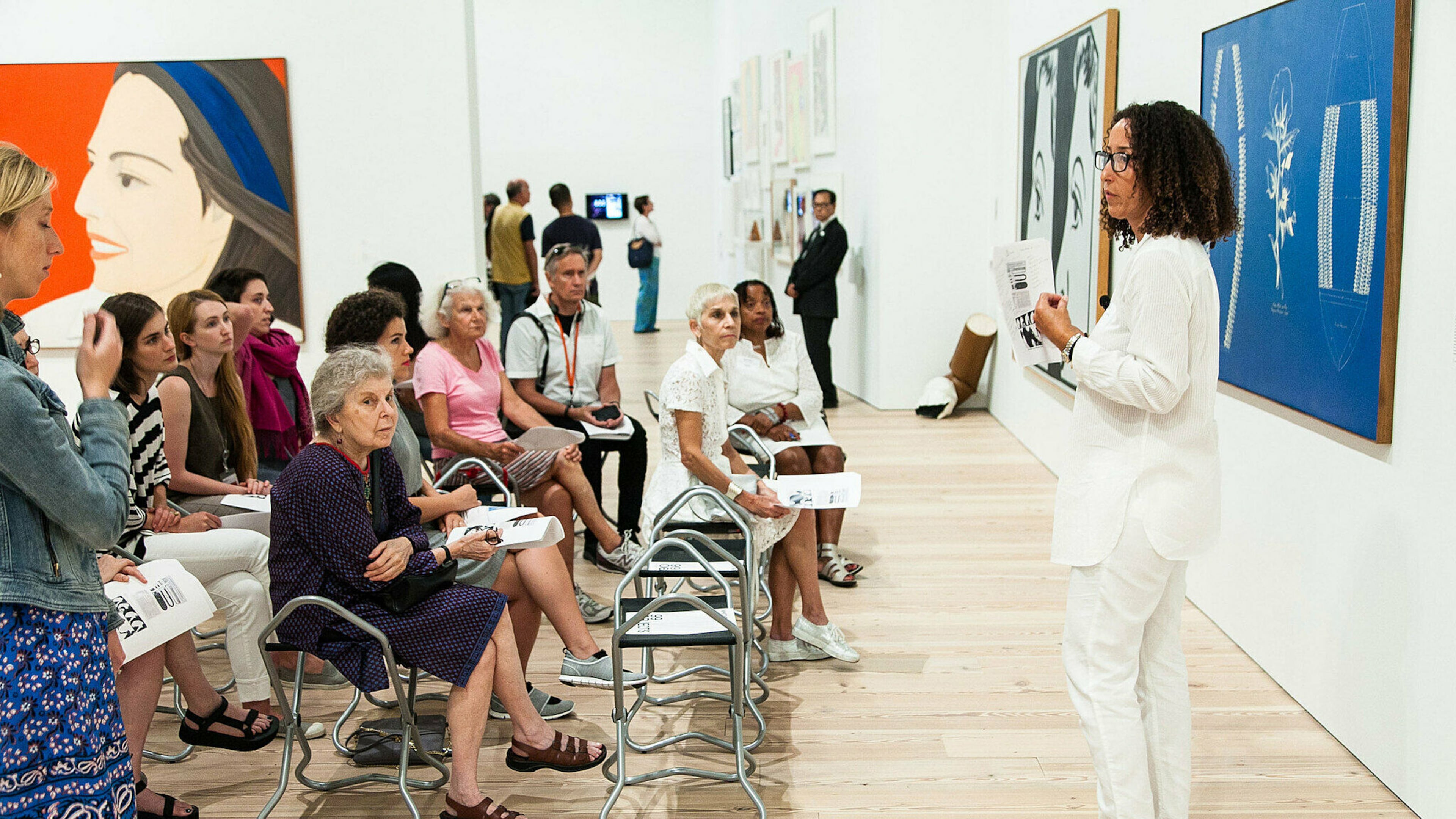 Art scholar Cheryl Finley (in white, far right) speaks at the Whitney Museum of Art in 2015 for the reopening in downtown New York of the show "99 Objects." (Courtesy of Cheryl Finley)