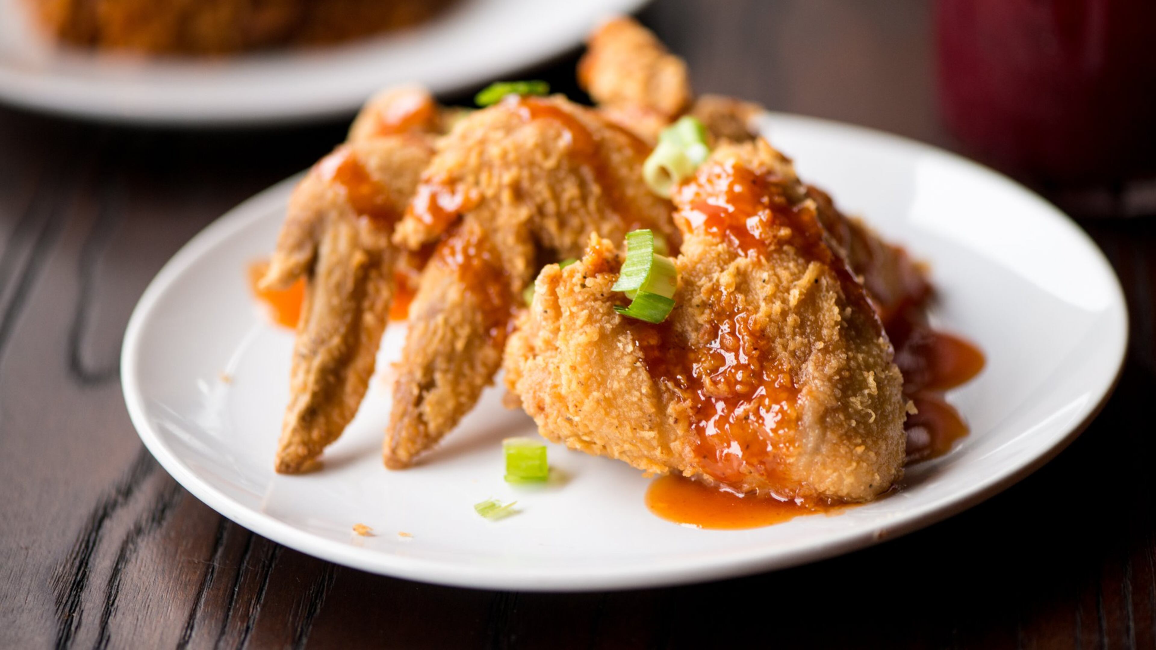 Jam Up Wings, seasoned and marinated hot wings drizzled with Gullah Gal sauce, is served fried or baked at Virgil’s Gullah Kitchen and Bar in West Midtown and Conyers. During Black Restaurant Week in Atlanta, which started Sunday, appetizers at Virgil's will be offered free with the purchase of an entree. (Courtesy of Mia Yakel)