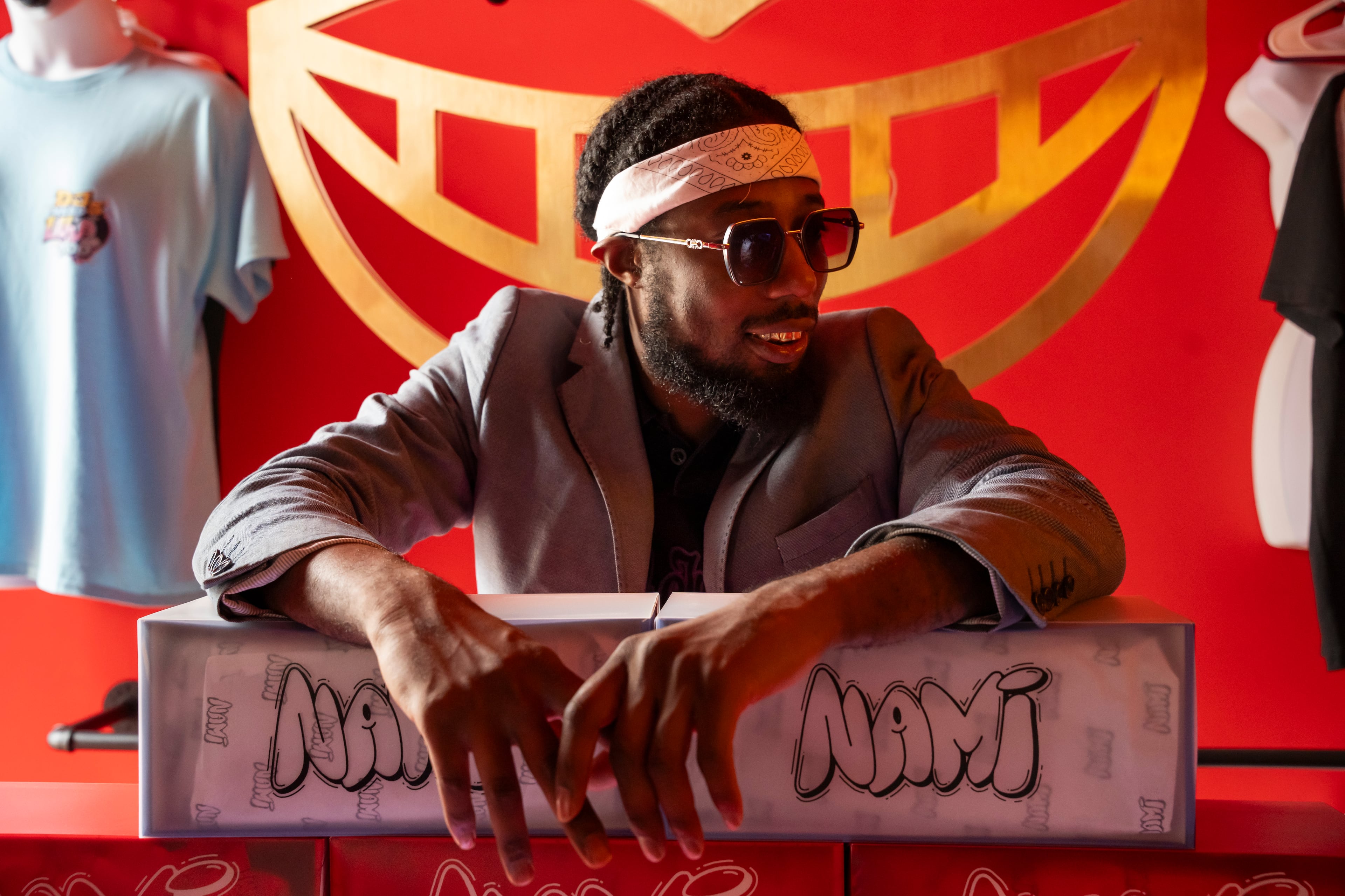 Haz Musa, founder of Royal Teeth Lab, shows off his custom-made grills in his showroom within Ndstry studios in Atlanta on Saturday, Sept. 6, 2025. (Olivia Bowdoin for the AJC)