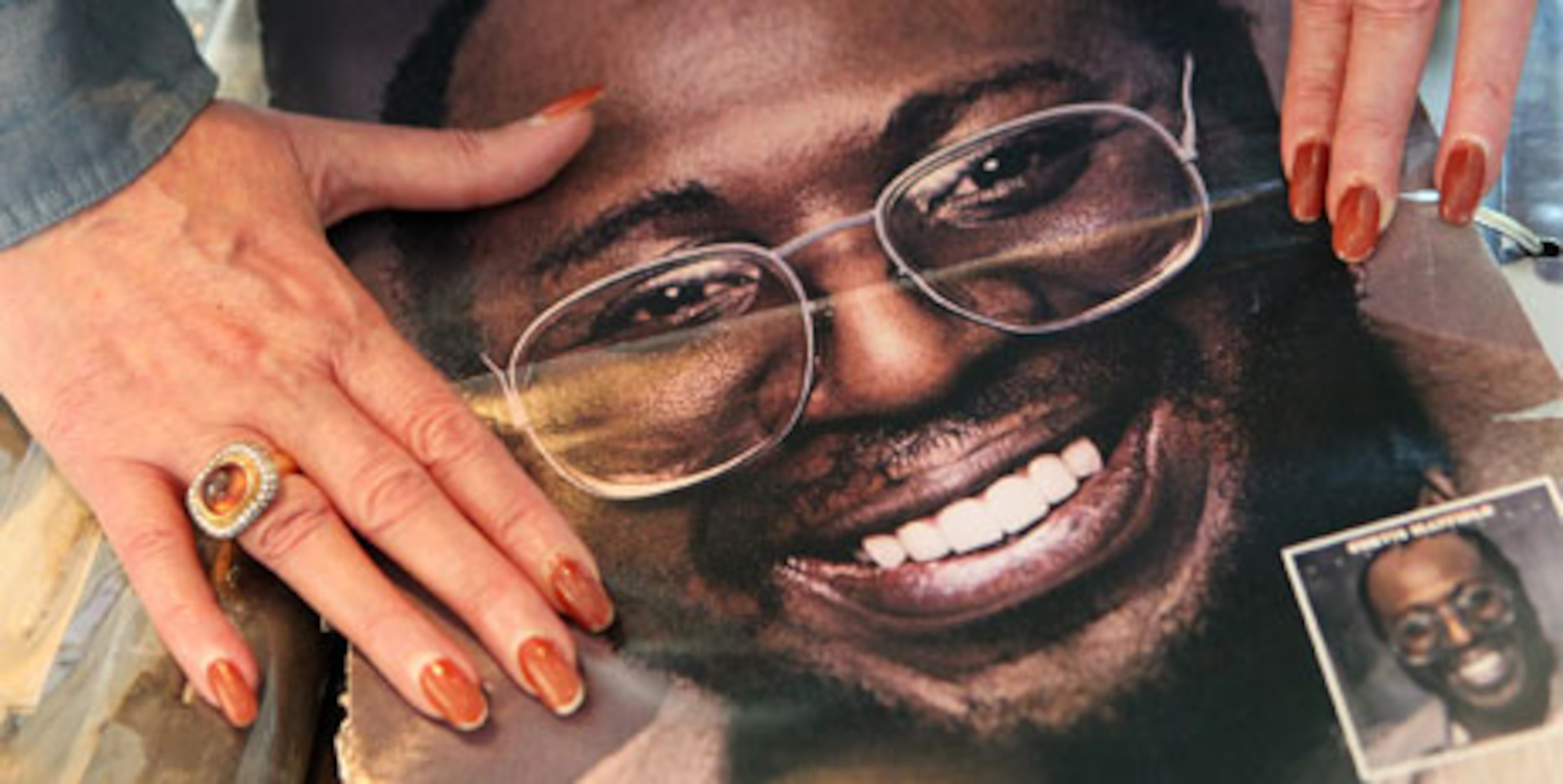 Altheida Mayfield, Curtis Mayfield's widow, flips through family albums. Mayfield, who moved to Atlanta from Chicago with his family in the late '70s and died here in '99, loved Atlanta's youthfulness, his widow said in 2010, and foresaw it was going to become an important music center. (AJC 2010)