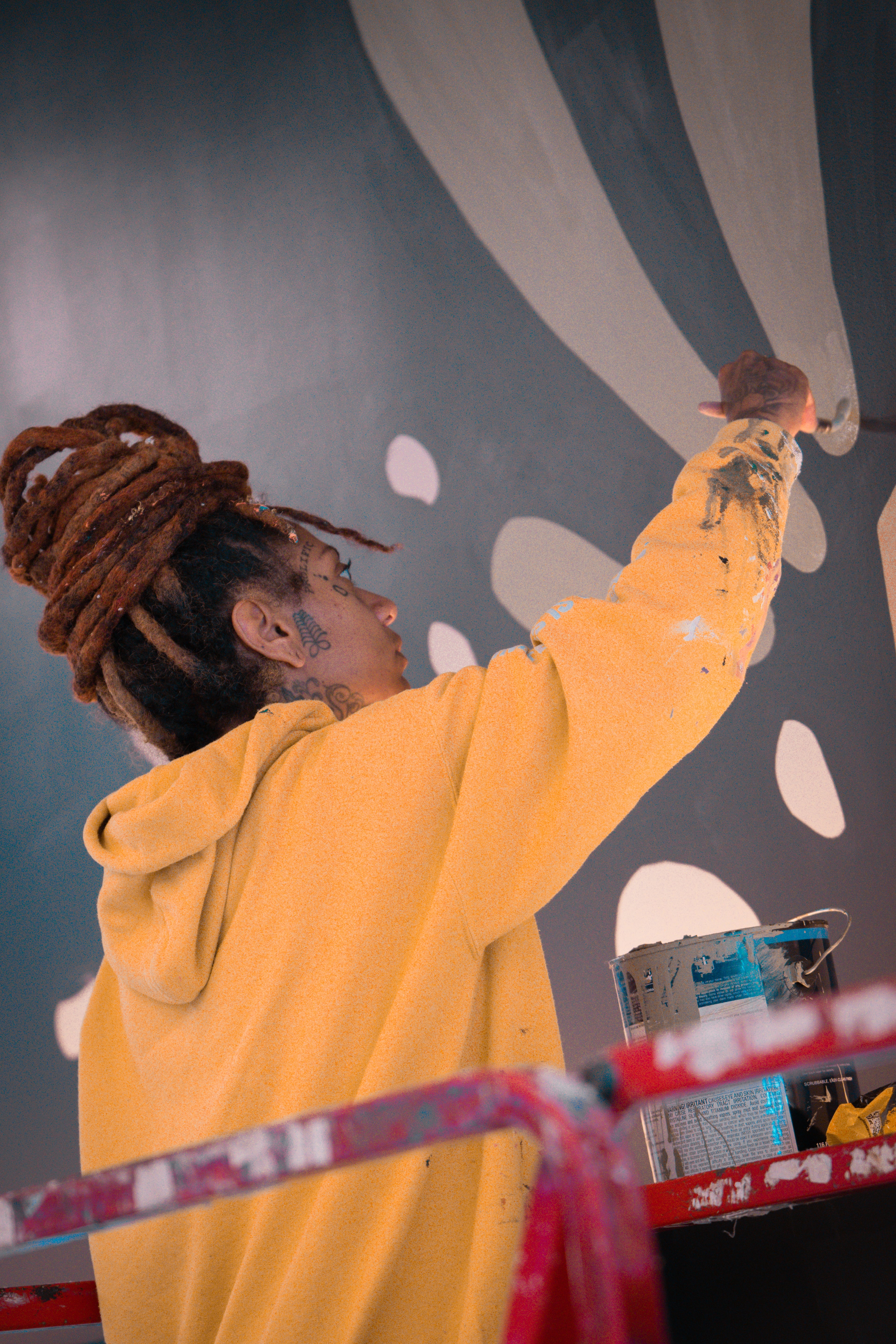 Charity Hamidullah paints the "Revival" mural for the installation at The CTR. Hamidullah is an Atlanta artist being highlighted for UATL's 404ward series, with the current focus on the performing and creative arts. (Photo by Angel Parrilla)