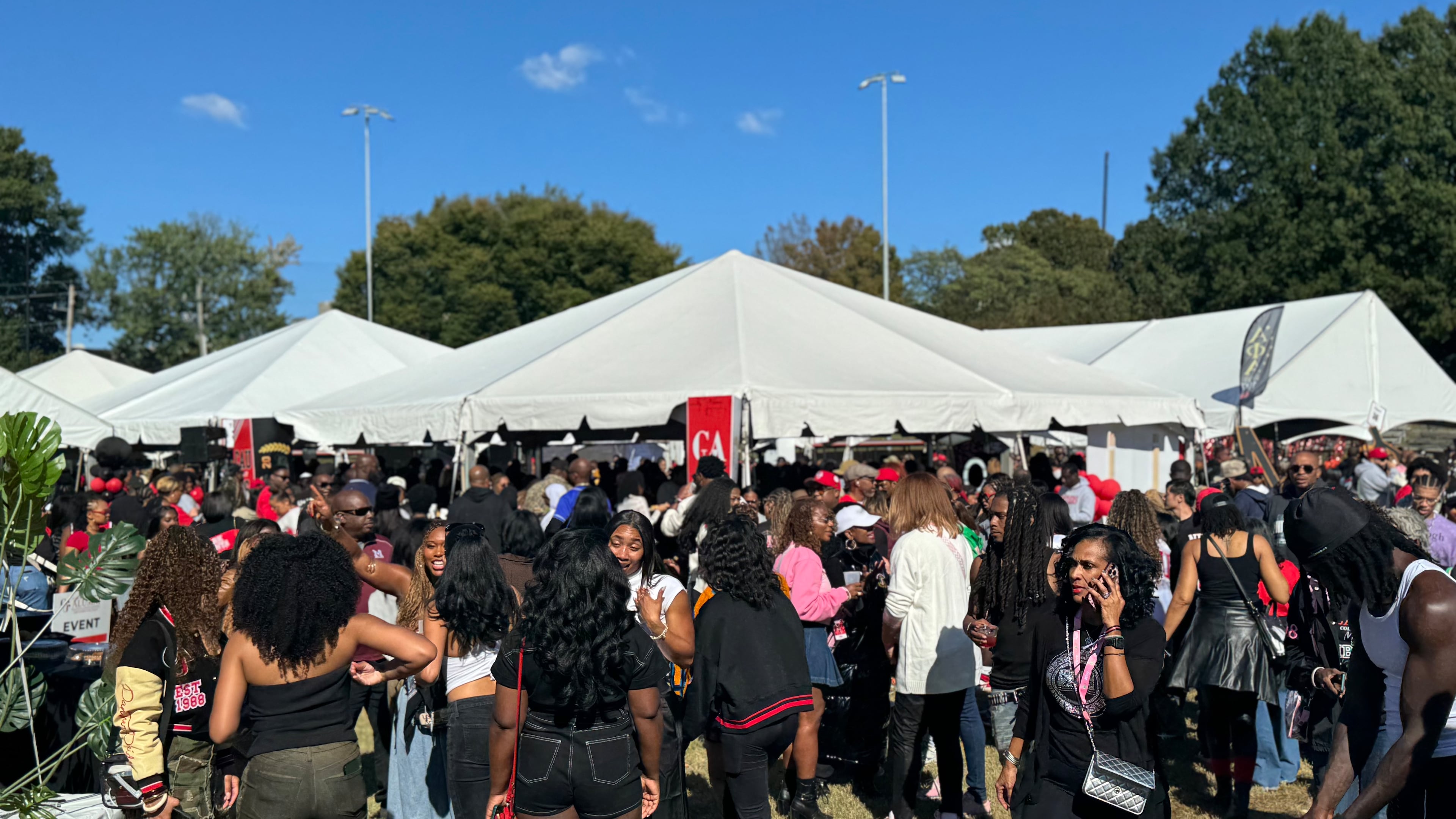 During Clark Atlanta University homecoming on Oct. 17, 2026, school alumni and students attend tailgating at tents next to the CAU Panther Stadium. (Brooke Leigh Howard/AJC)