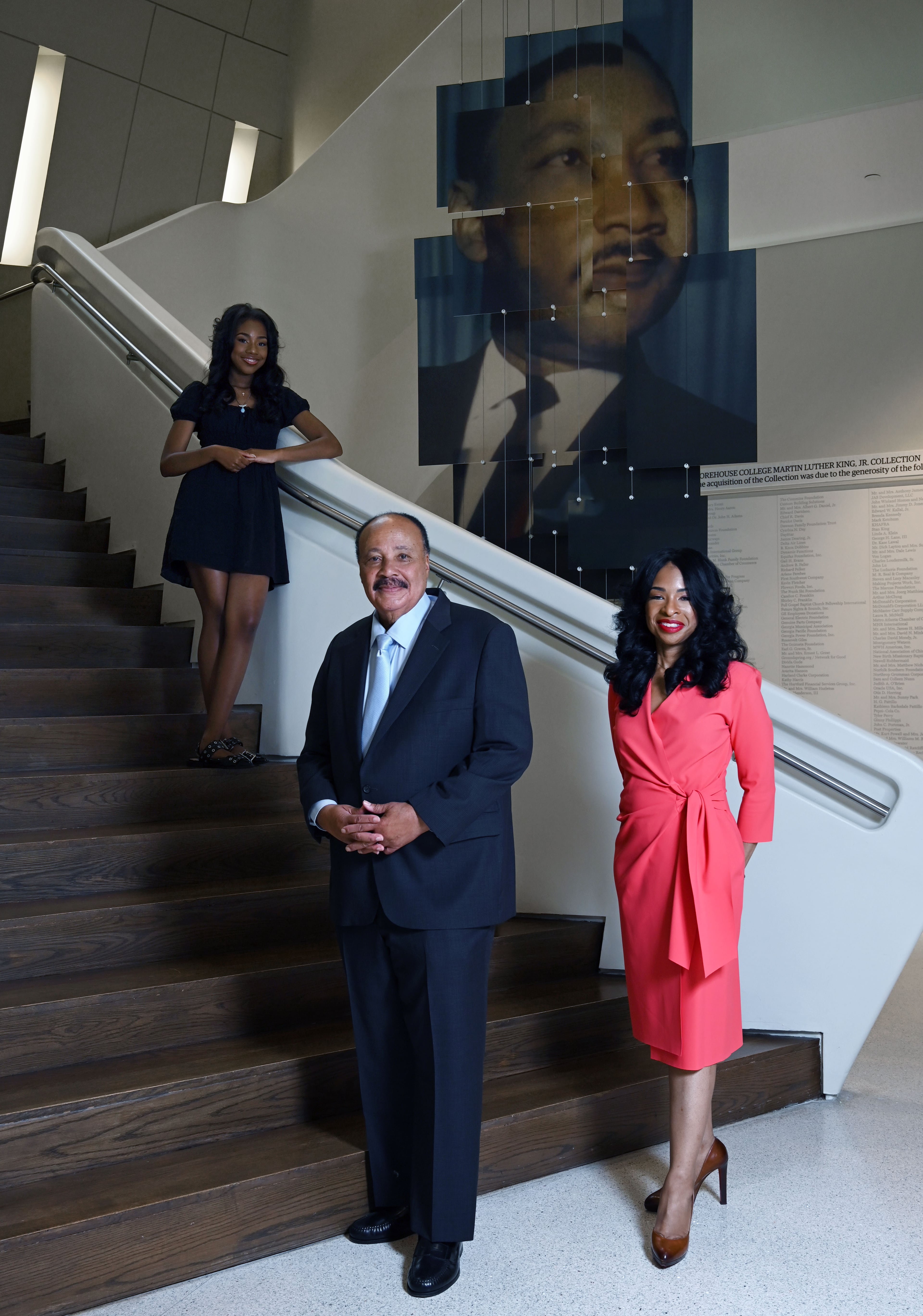 The King family — Martin Luther King III, wife Arndrea Waters King, and daughter Yolanda Renee King — pose for a portrait at the National Center for Civil and Human Rights on Friday, June 12, 2026, in Atlanta. (Hyosub Shin/AJC)