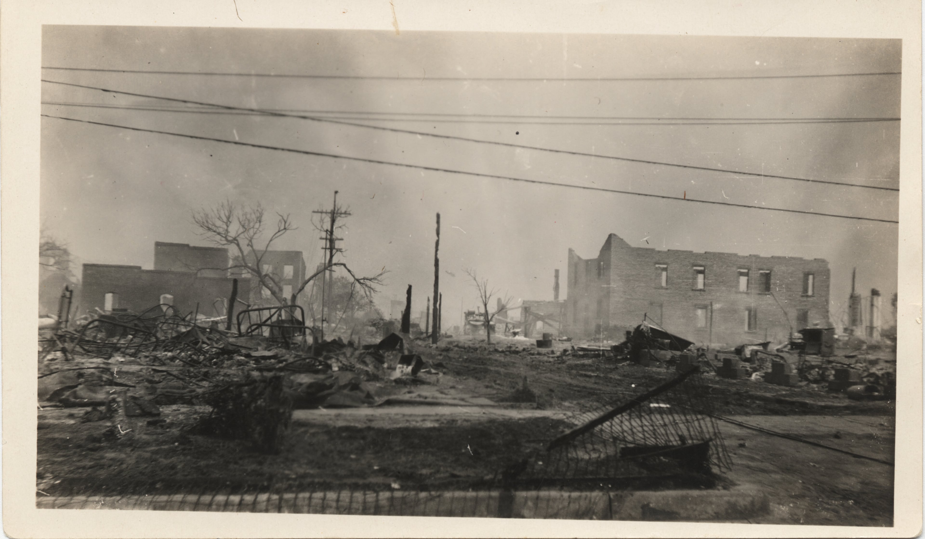 This photo provided by The University of Tulsa shows ruins after the Tulsa Race Massacre, June 1, 1921, in Tulsa, Okla. (The University of Tulsa McFarlin Library/Department of Special Collections and University Archives via AP)