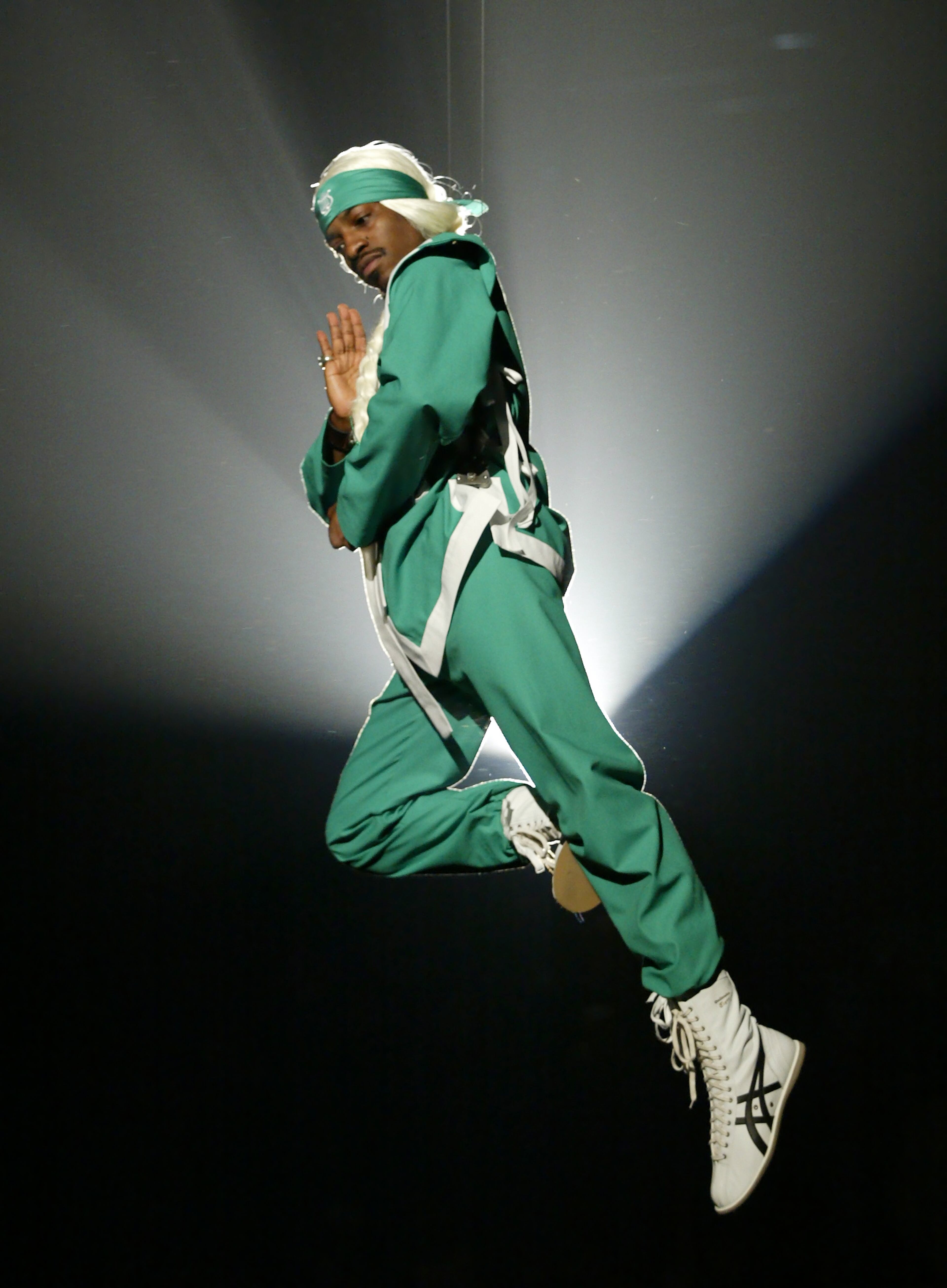 OutKast singer Andre 3000 flies in over the audience as he performs "Hey Ya!" at Nickelodeon's 17th Annual Kids' Choice Awards, Saturday night, April 3, 2004, in Los Angeles. (Mark J. Terrill/AP)