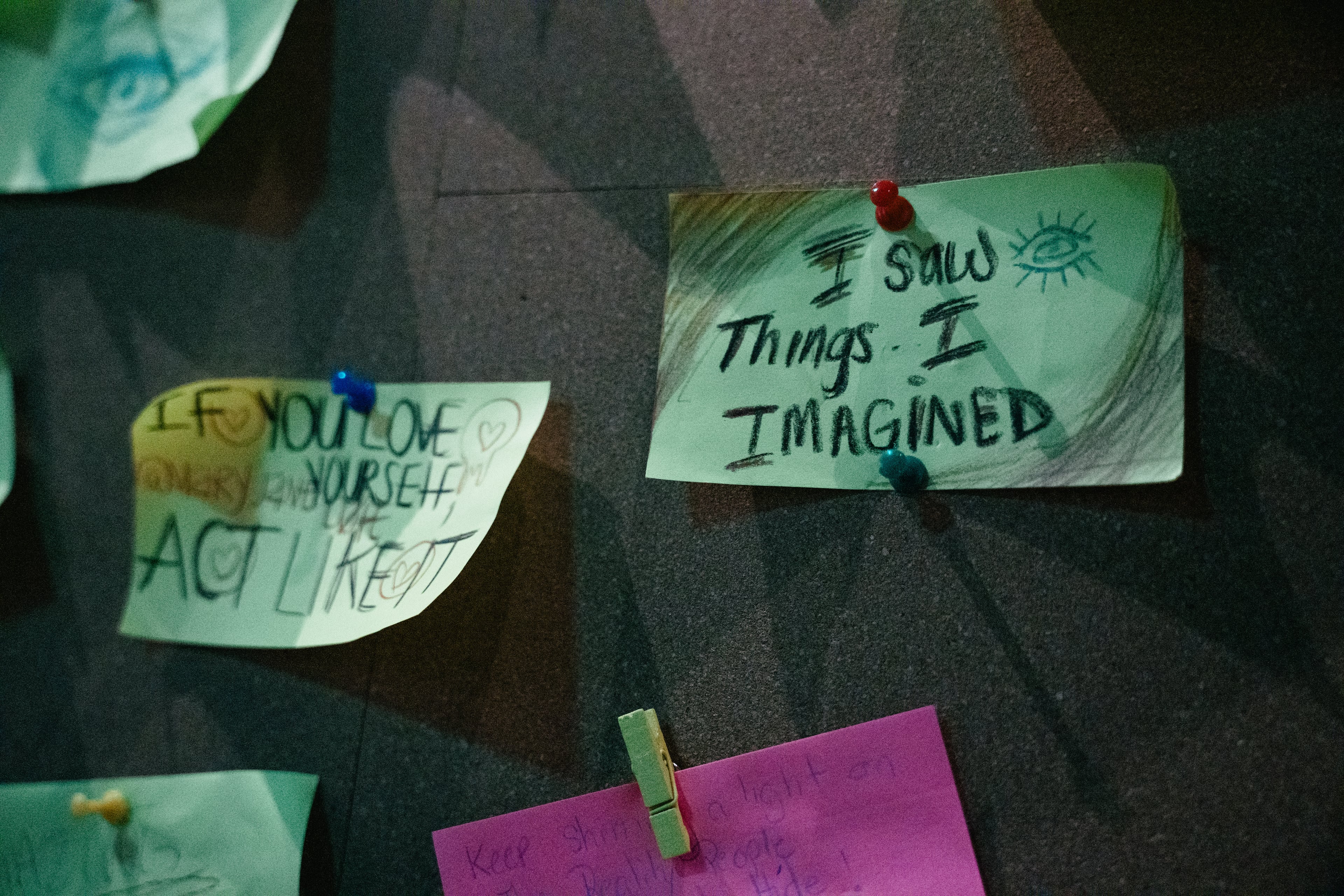Cards displaying visitors’ ideas and reflections are arranged in the future room during a preview of “Mothership Sirius B” on Aug. 12, 2026, in Atlanta. Visitors are encouraged to write down ideas for positive change after spending time in the room. (Olivia Bowdoin/AJC)