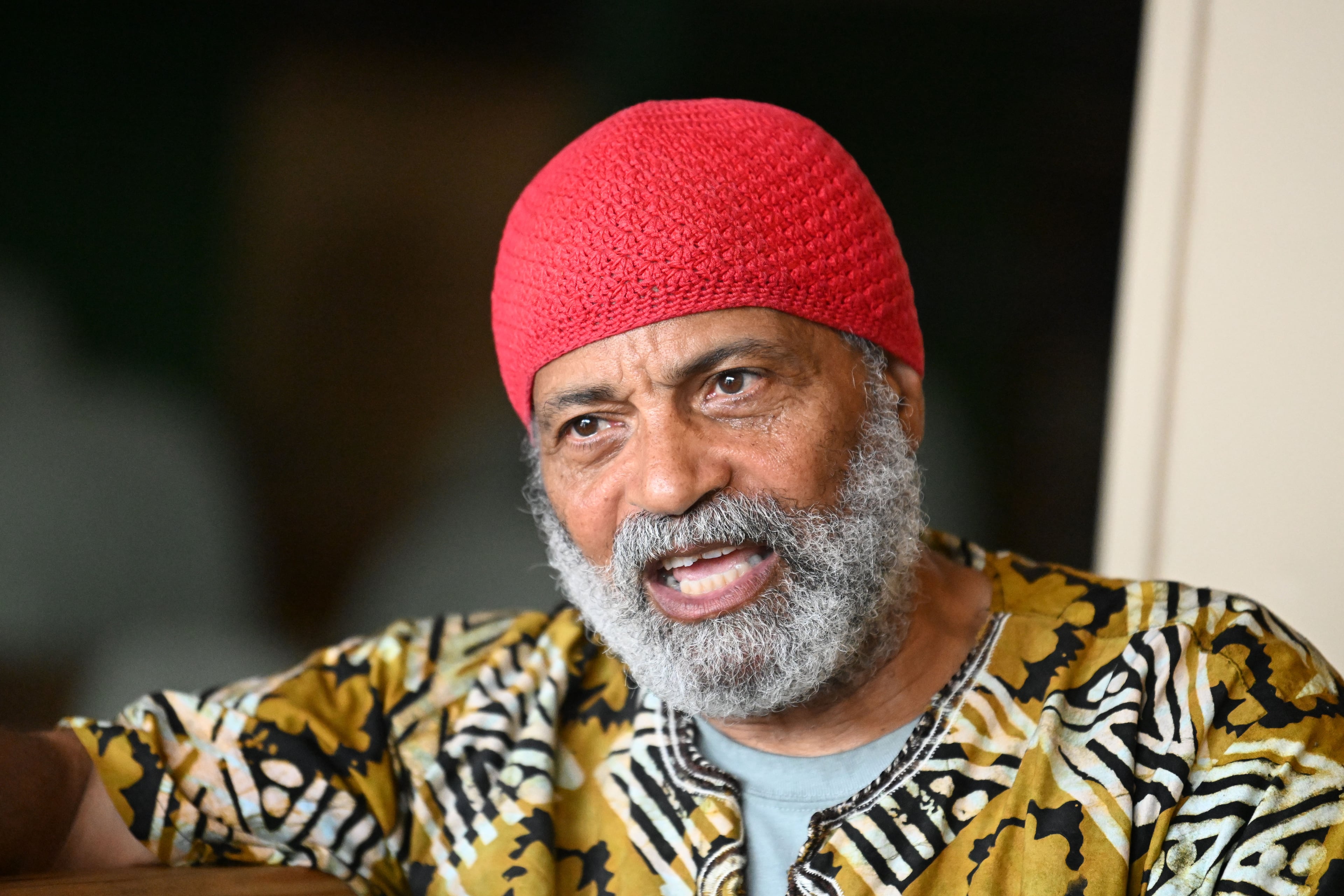 St. Micael Shaleahh, right, one of the restaurant's original co-owners, speaks at The New Soul Veg on Thursday, July 9, 2026, in Atlanta. (Hyosub Shin/AJC)
