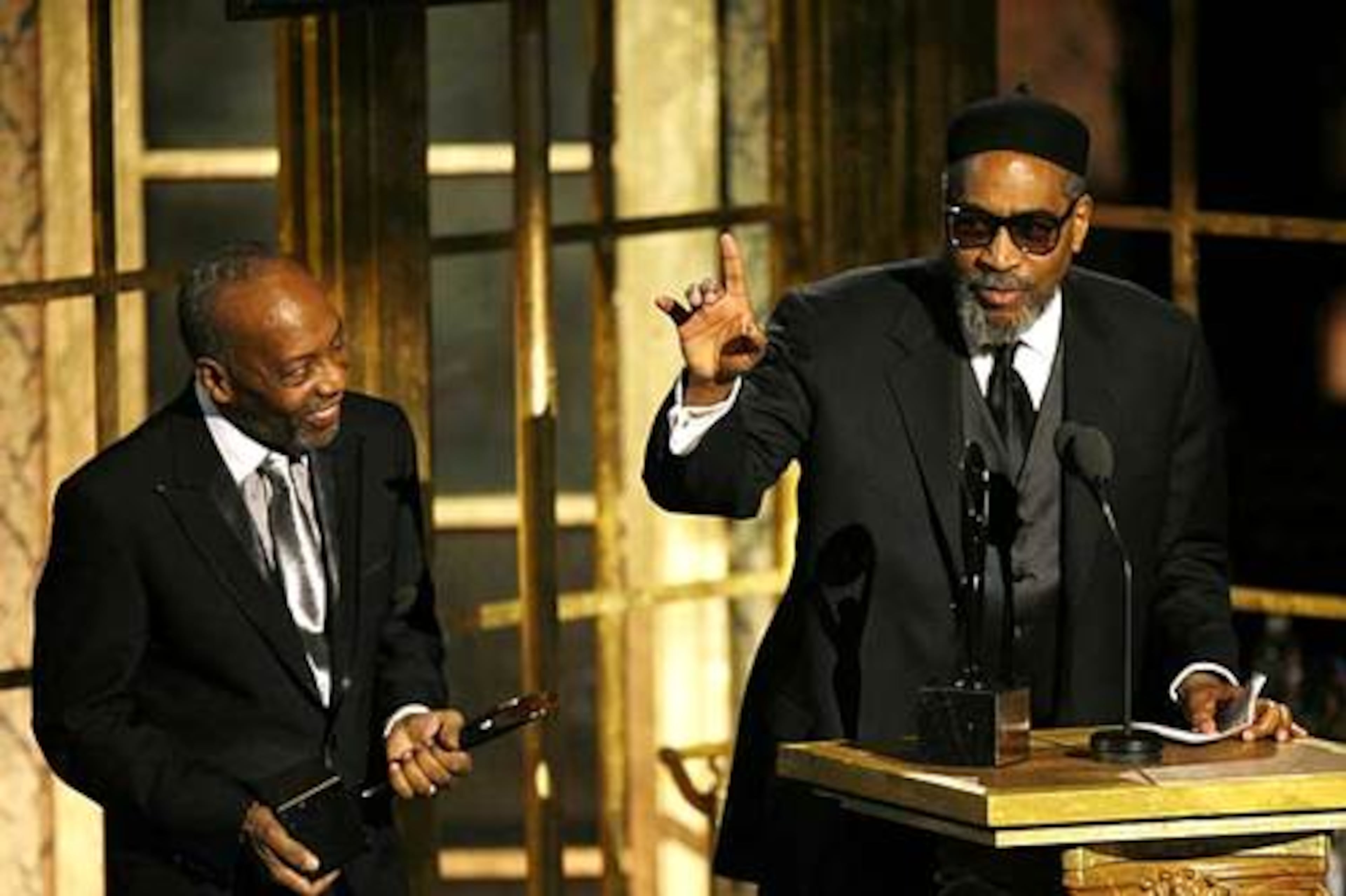 Famed Philly soul producer Kenny Gamble (right), with songwriting and producing partner Leon Huff, invites the audience to answer back his wish for "peace." The pair were given the Ahmet Ertegun Award. Gamble is a co-founder of Black Music Month in June.(Jason DeCrow/AP 2008).