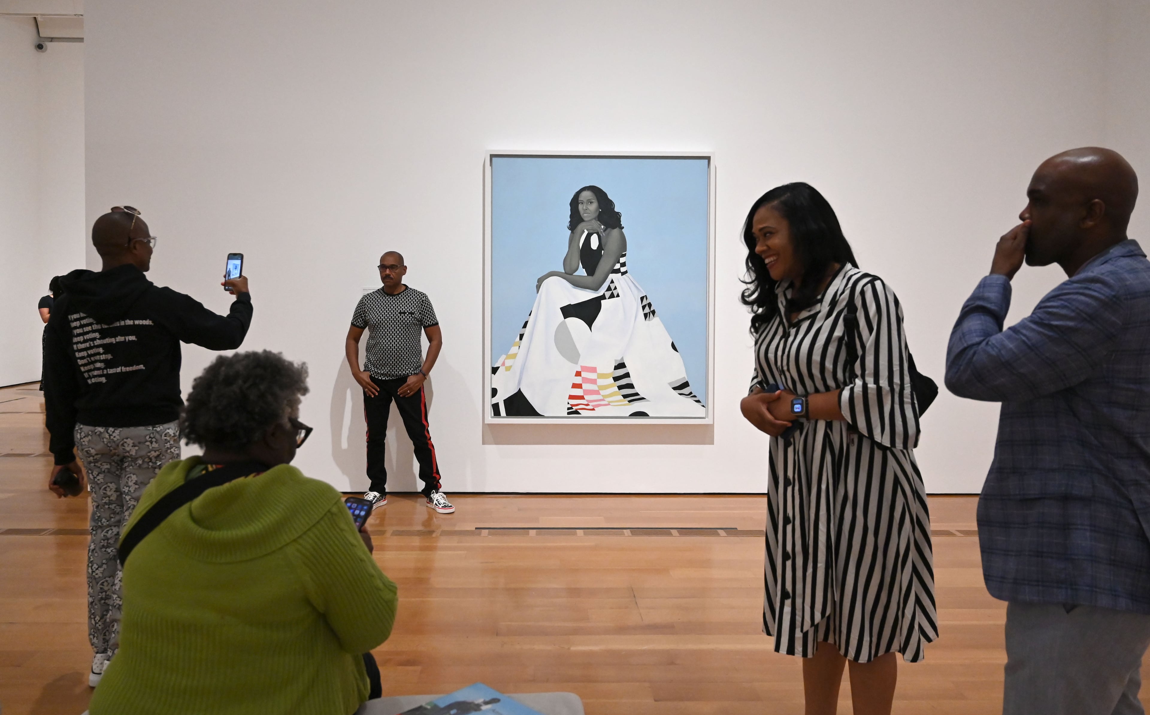 Visitors look at “Michelle Obama” in the “American Sublime” exhibition at the High Museum of Art on Friday, May 15, 2026, in Atlanta. (Hyosub Shin/AJC)