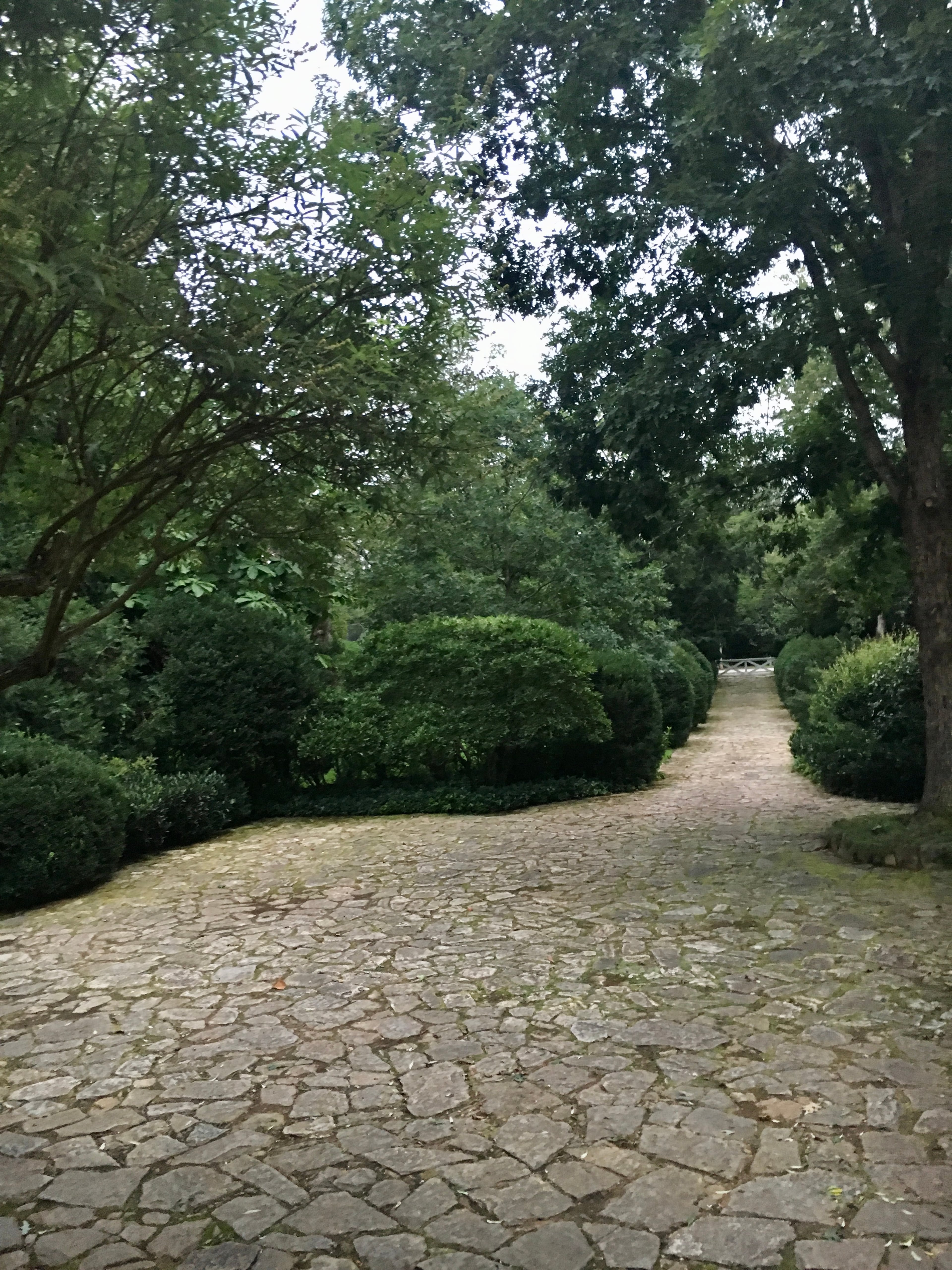 Former owner and Atlanta architect Neel Reid designed the front fieldstone driveway and courtyard in the shape of a champagne glass, according to former owner Sally Hansell. (Courtesy of Sally Hansell)