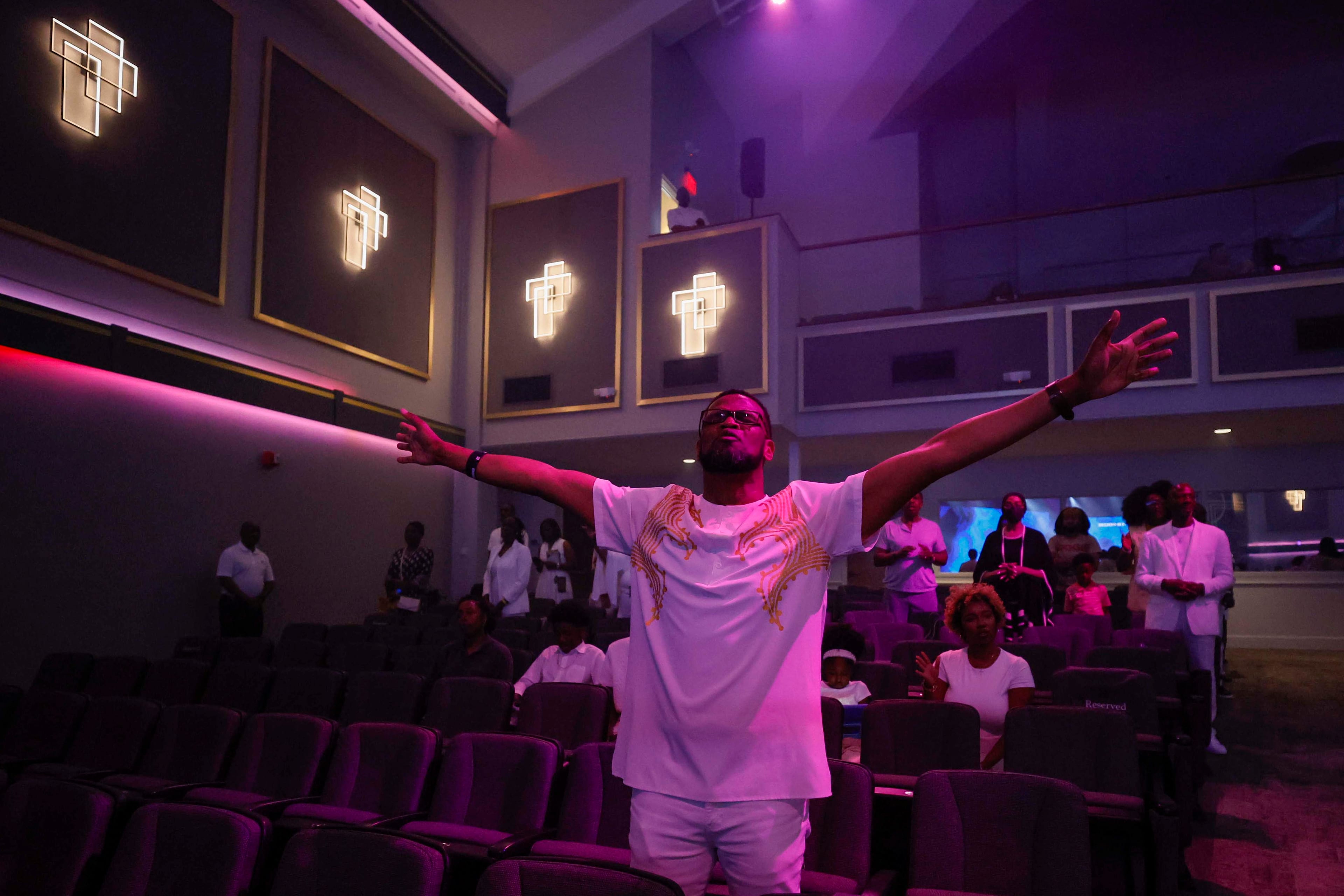 A parishioner reacts as he sings along with the choir during the 30th pastoral anniversary of Bishop Craig Oliver Sr. at Elizabeth Baptist Church on Sunday, June 8, 2025. (Miguel Martinez/AJC)