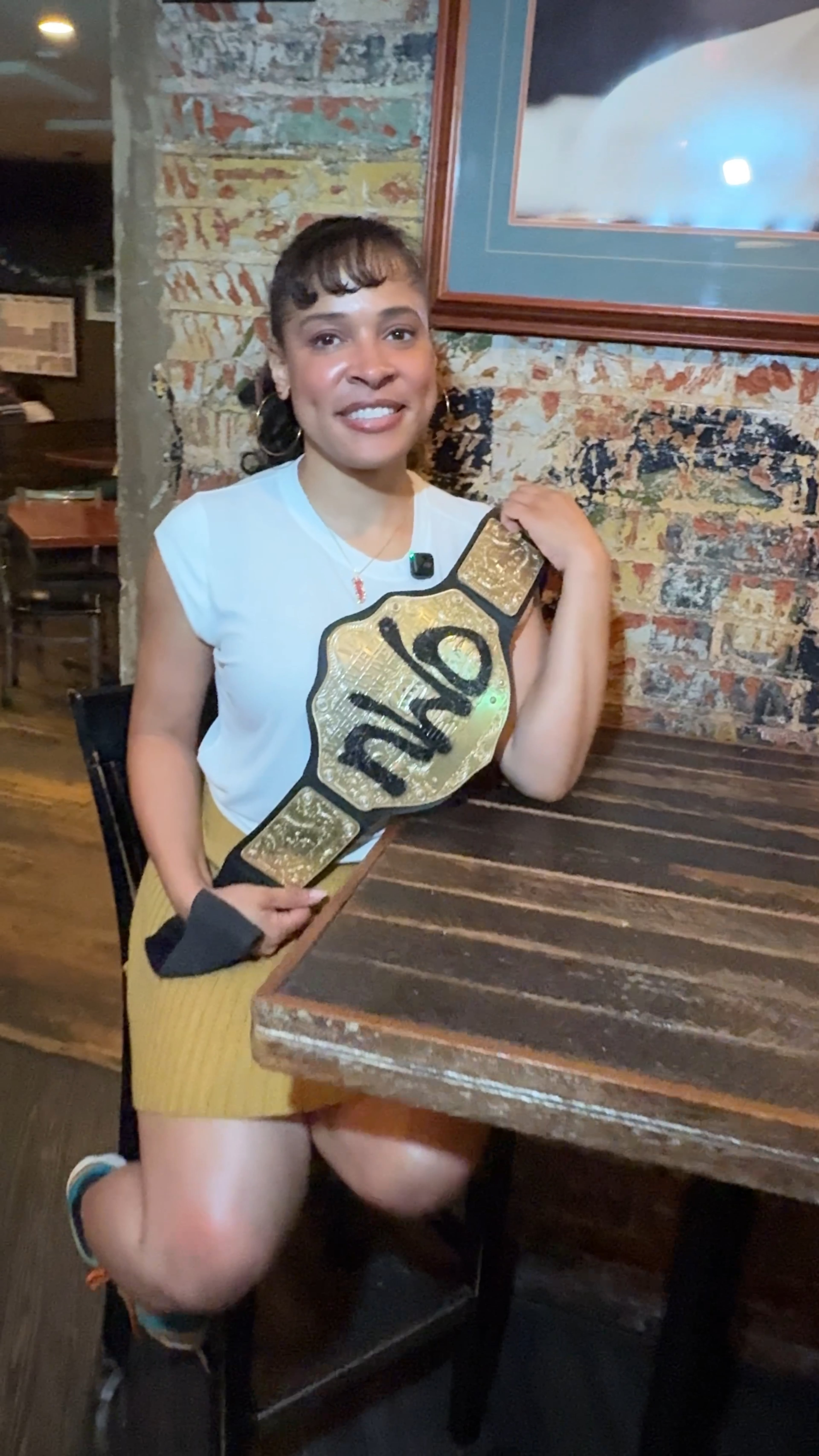UATL culture reporter Brooke Leigh Howard details her weekly tradition of trivia night at The Imperial in Decatur. Howard poses with the trivia night Imperial Belt. (Shimei Cook/AJC)