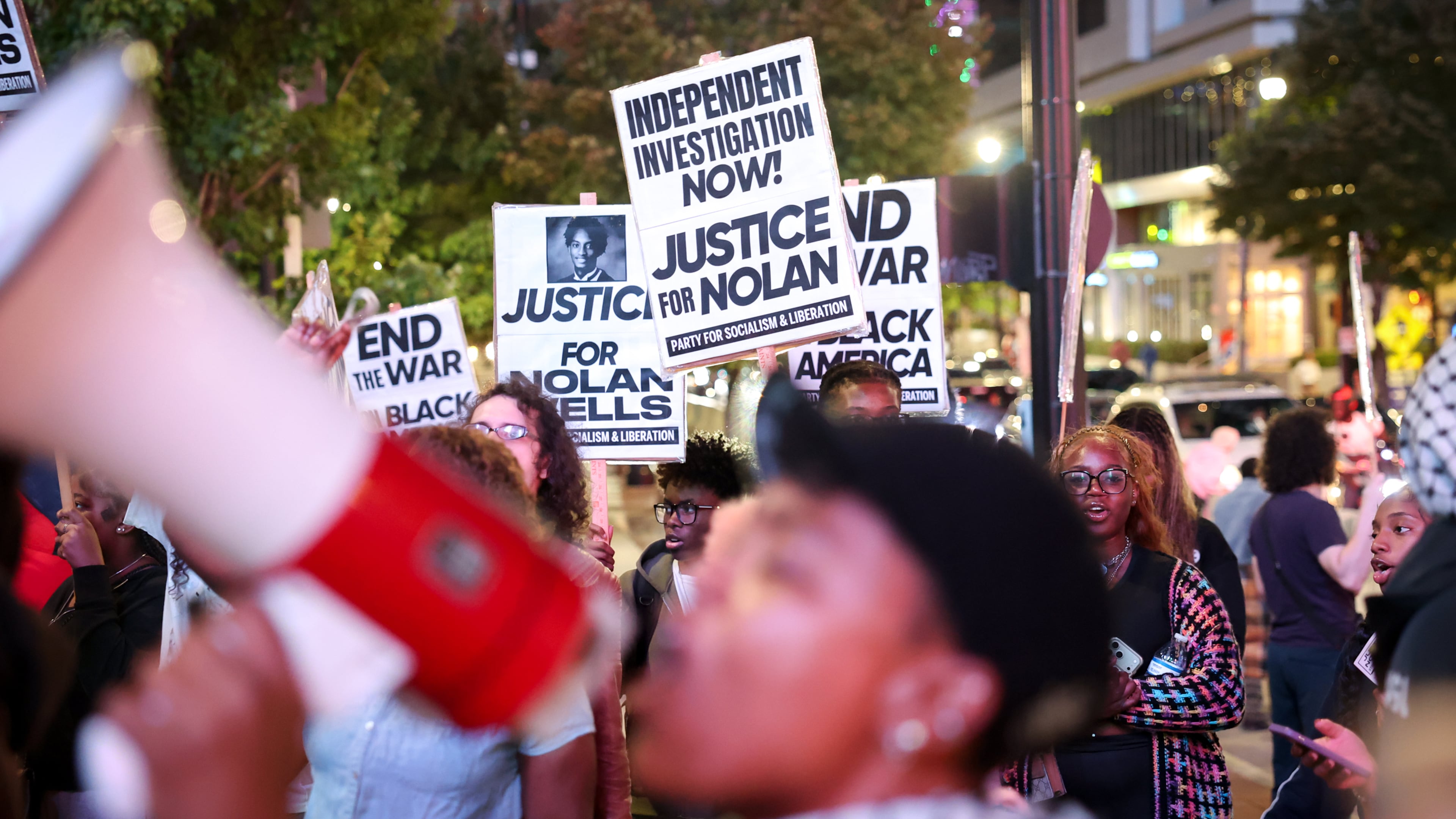 Protestors demand justice for Mississippi’s Nolan Wells outside Centennial Olympic Park in Atlanta on Oct. 6, 2026. (Arvin Temkar/AJC)