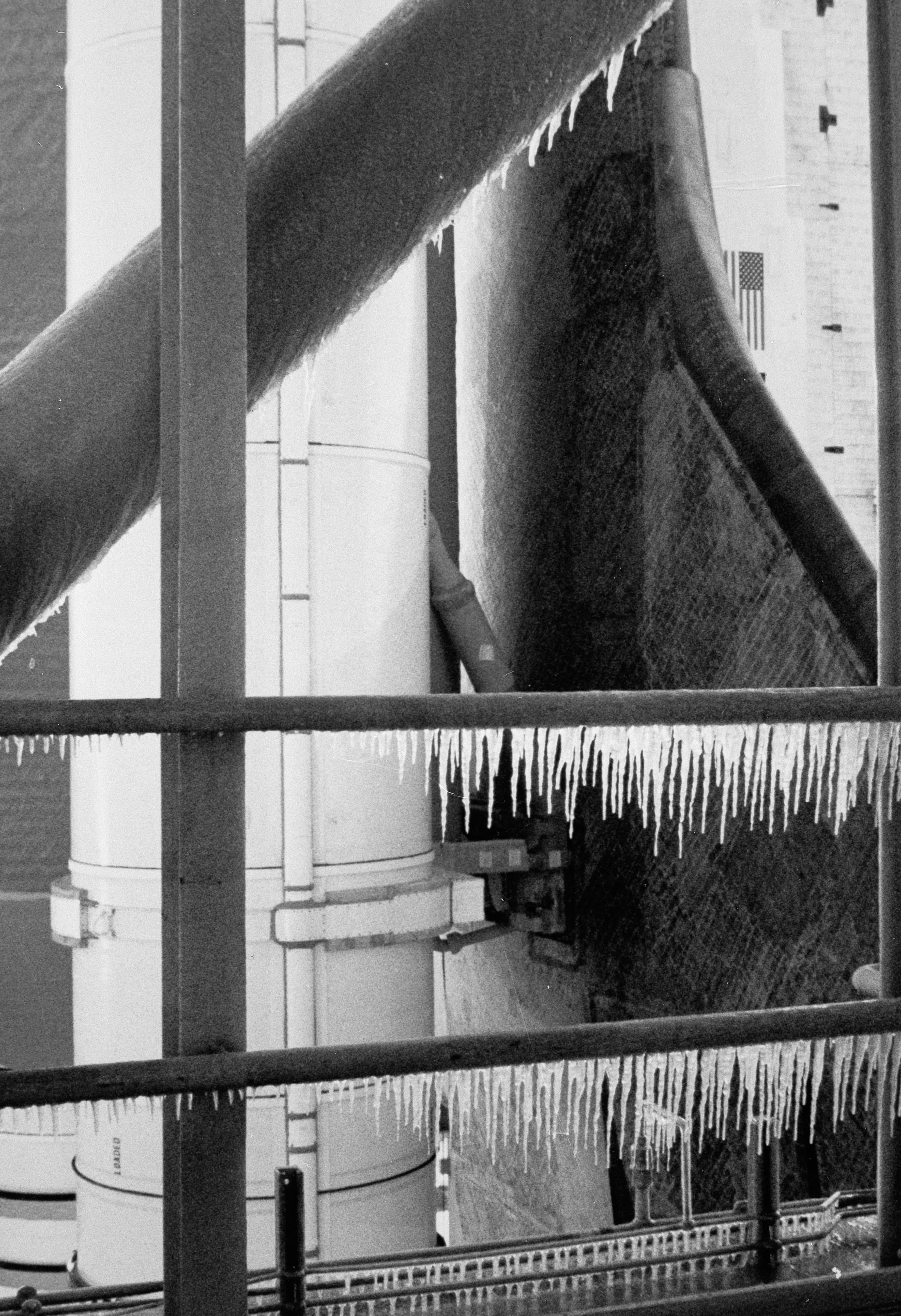 Icicles hang from handrails on the space shuttle Challenger's service structure on the morning of Jan. 28, 1986, at Kennedy Space Center in Florida. The cold weather affected O-ring seals on a solid rocket booster, causing the explosion during launch. (NASA/AP)
