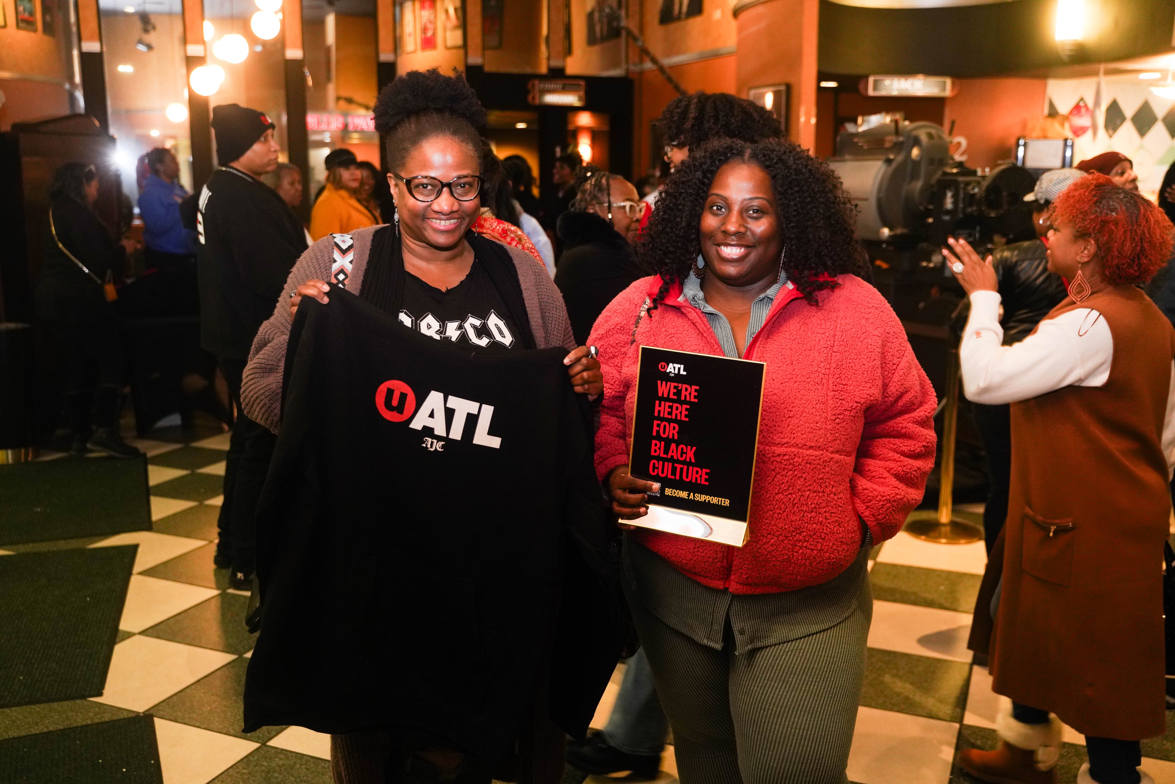 Attendees of UATL Movie Night usually don't leave without some swag. (Ivory Smith for the AJC)