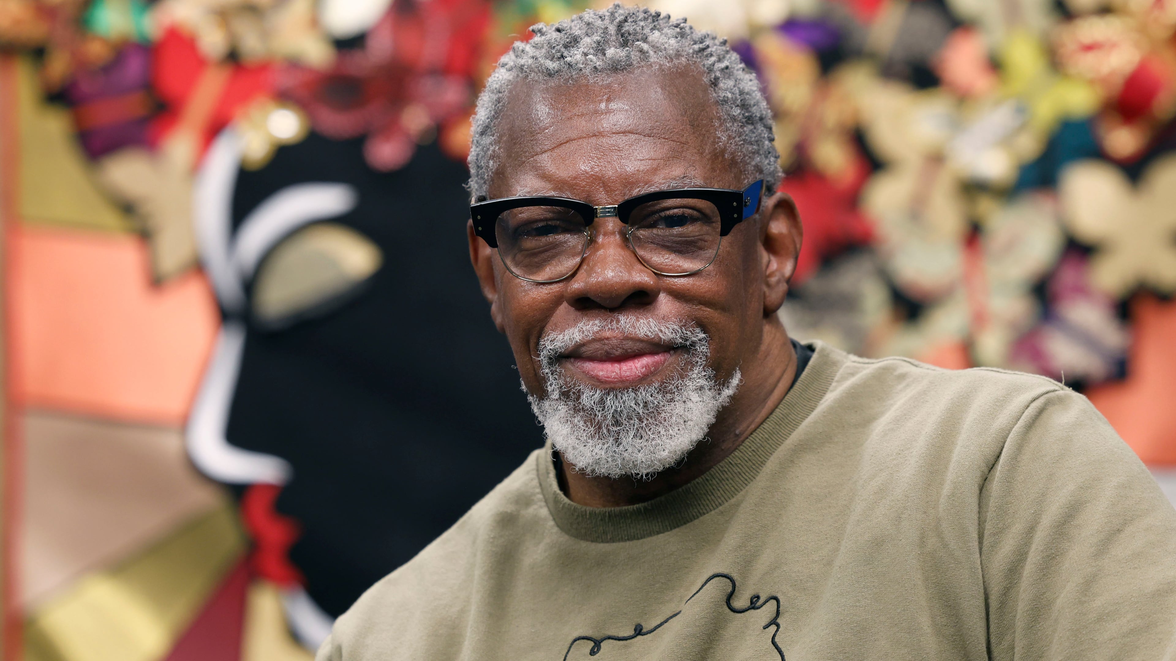 Artist J. Stacey Grayson at the opening of his art exhibition at the Fulton County Central Library. Saturday, November 8, 2025. (Akili-Casundria Ramsess, EyeAkili Media for the AJC)
