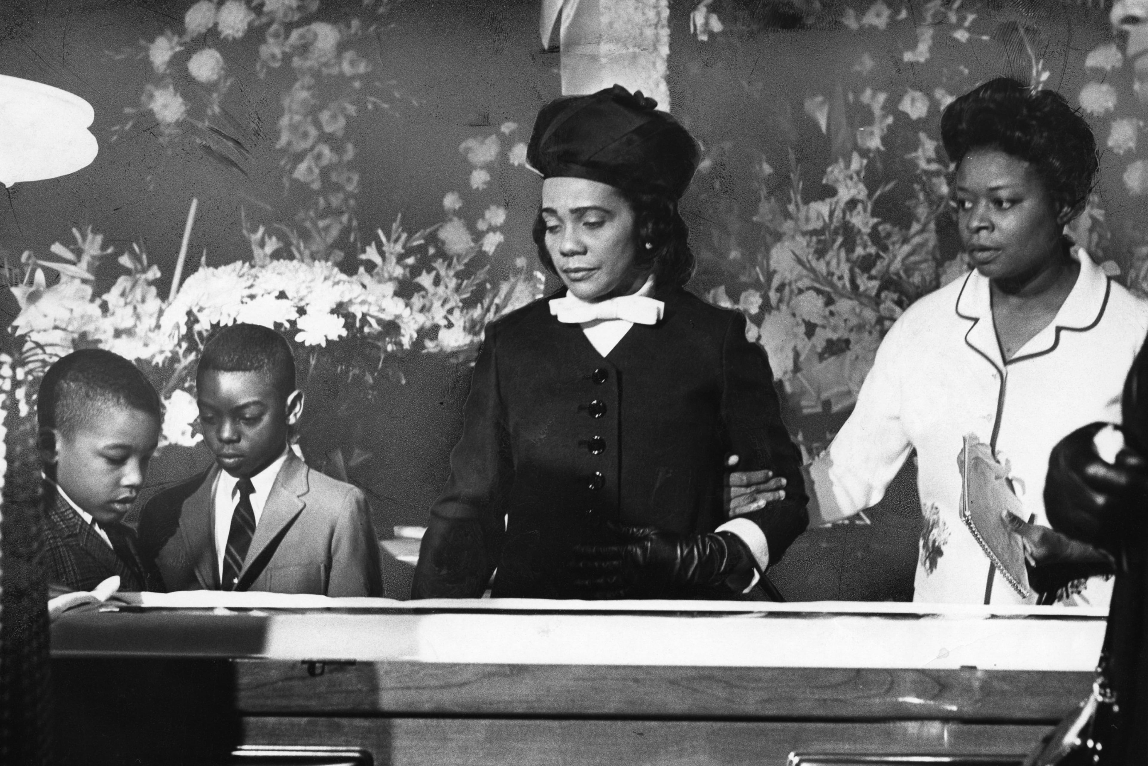 Coretta Scott King attends the funeral service and casket viewing of Martin Luther King Jr. with family in Atlanta in April 1968. (Dwight Ross Jr./The Atlanta Journal-Constitution)