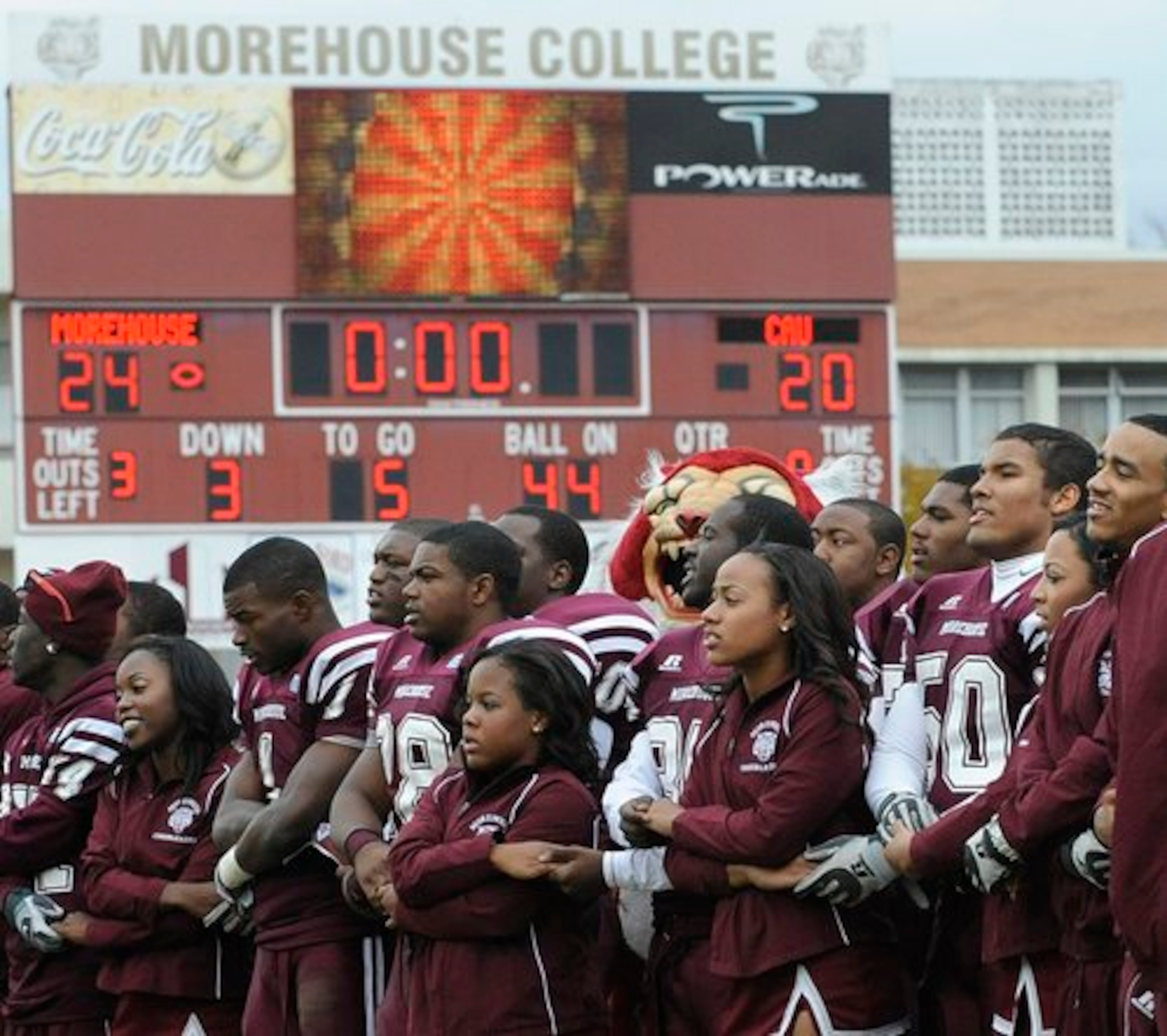 Morehouse College football players and cheerleaders join hands and sing the Morehouse school song after defeating Clark Atlanta University 24-20 in 2009. (Photographer: Johnny Crawford)