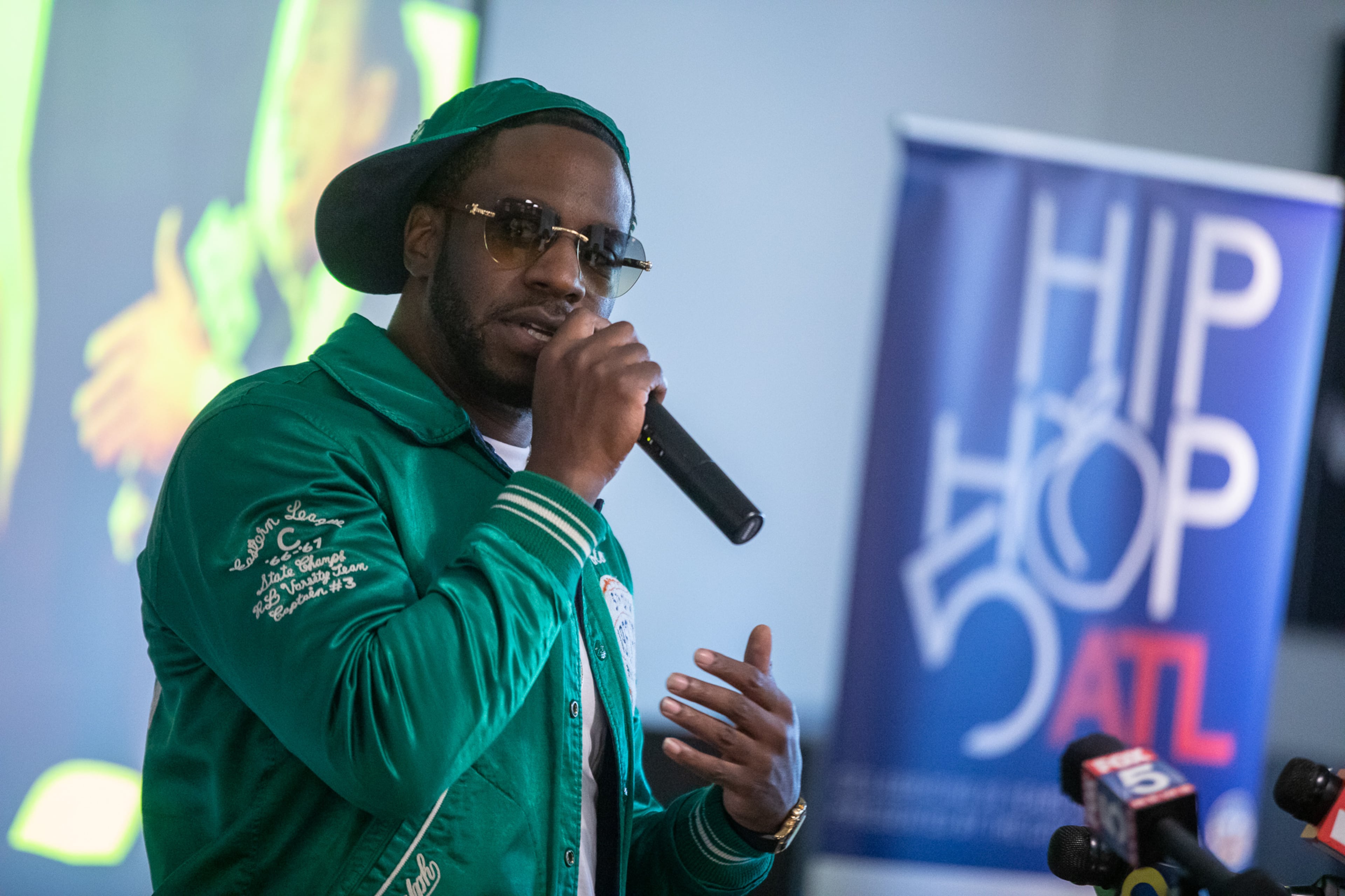 Hip hop artist Young Dro speaks at a city of Atlanta event celebrating 50 years of hip hop on Dec. 7, 2023. (Riley Bunch/AJC)