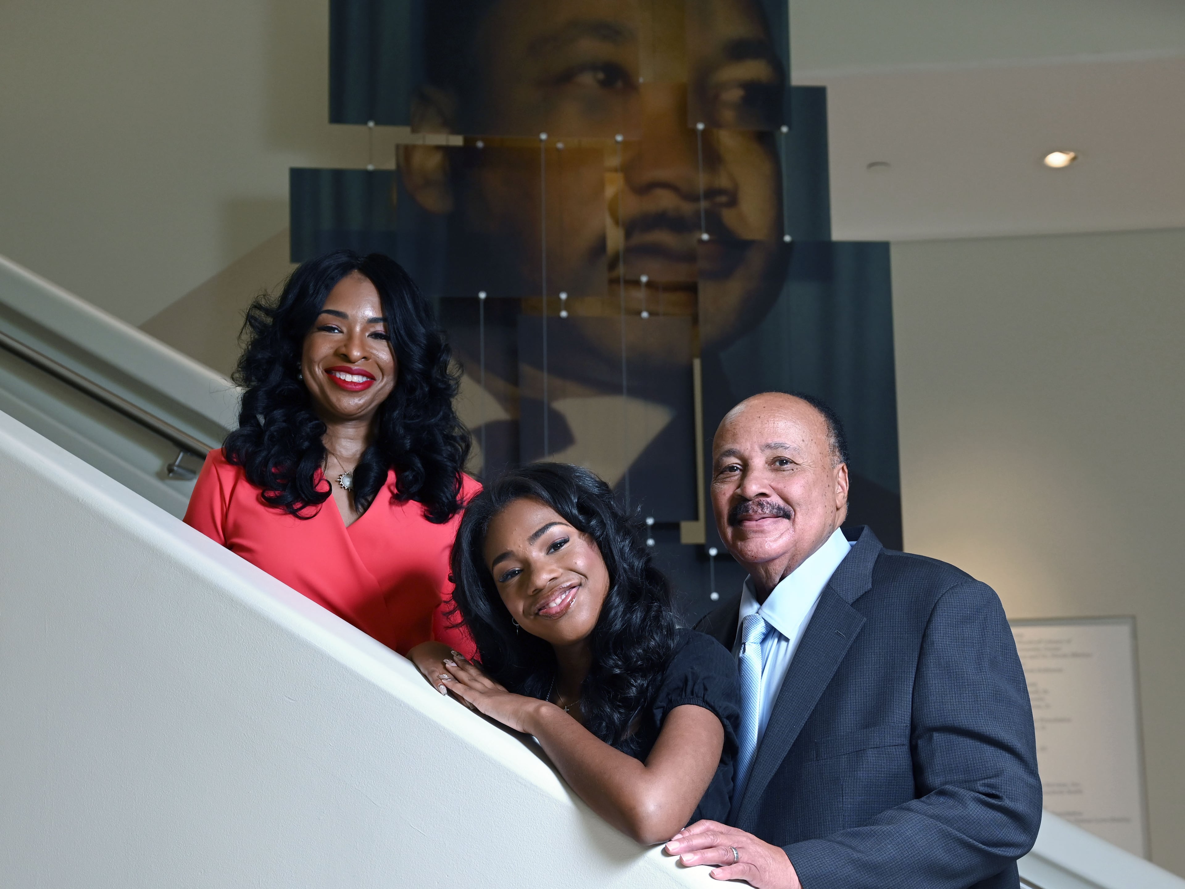 The King family — Martin Luther King III, wife Arndrea Waters King, and daughter Yolanda Renee King — pose for a portrait at the National Center for Civil and Human Rights on Friday, June 12, 2026, in Atlanta. (Hyosub Shin/AJC)