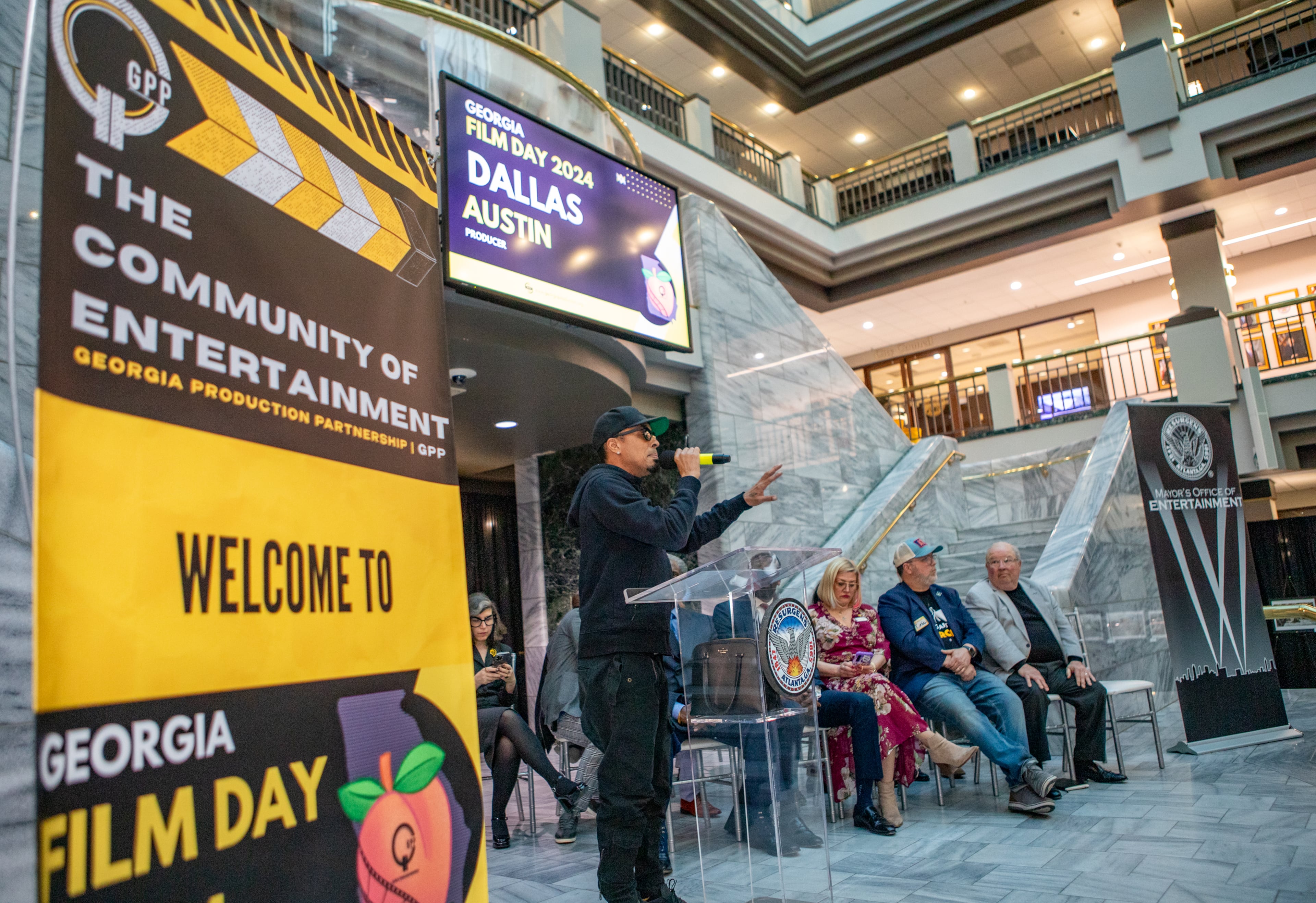 Music and film producer Dallas Austin address the crowd, including Mayor Dickens and other government representatives and Atlanta actors, producers and directors during Georgia Film Day 2024 at City Hall. (Jenni Girtman for The Atlanta Journal-Constitution)