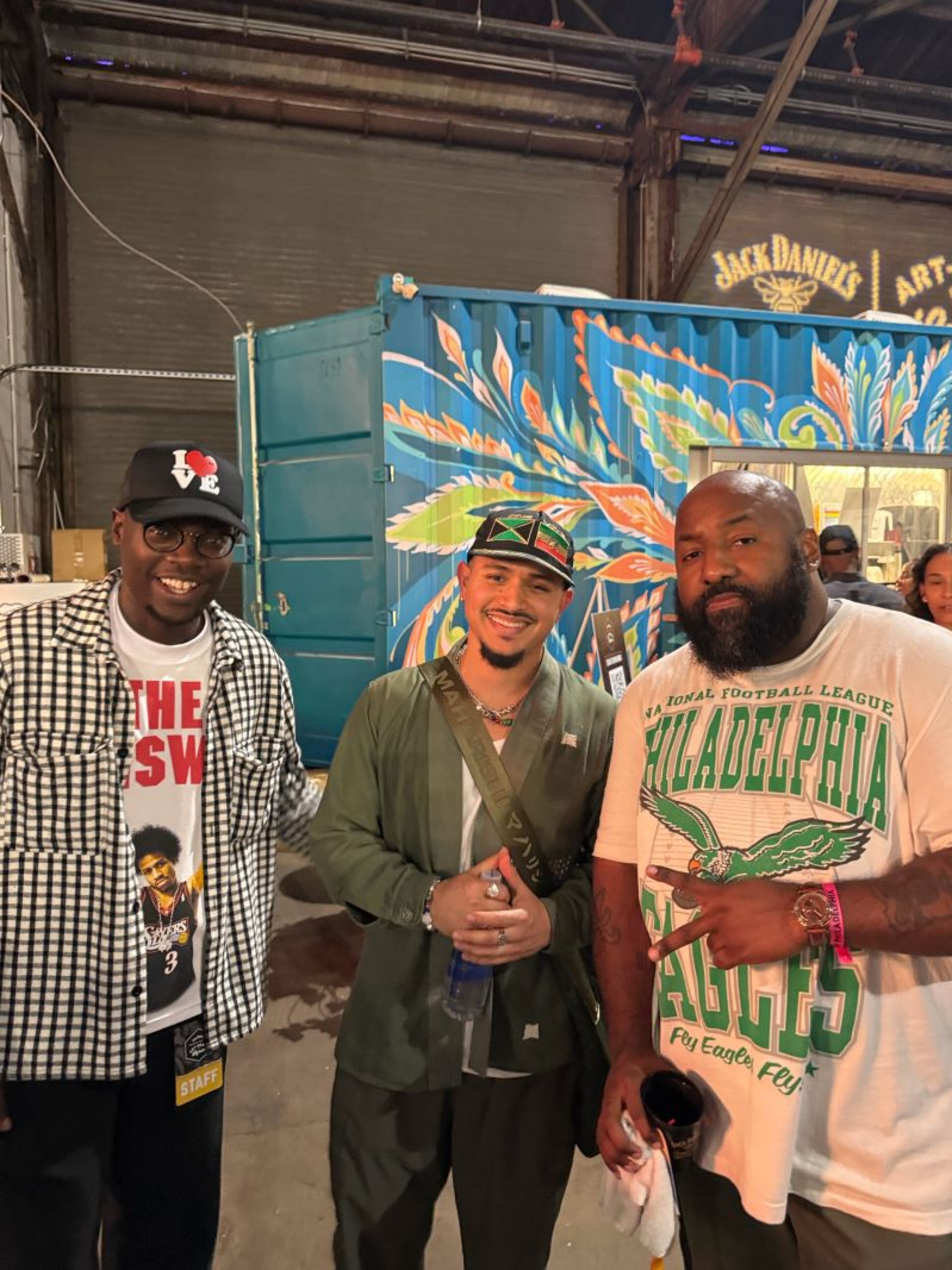 Yusuf "Yuie" Muhammad, a visual artist, event producer and creative director (from left), DJ Joe Kay, and Atlanta-based DJ and event producer Sean Falyon hang out at Arts Beats and Lyrics in Philadelphia on Sept. 12, 2025. (Courtesy of Sean Falyon)