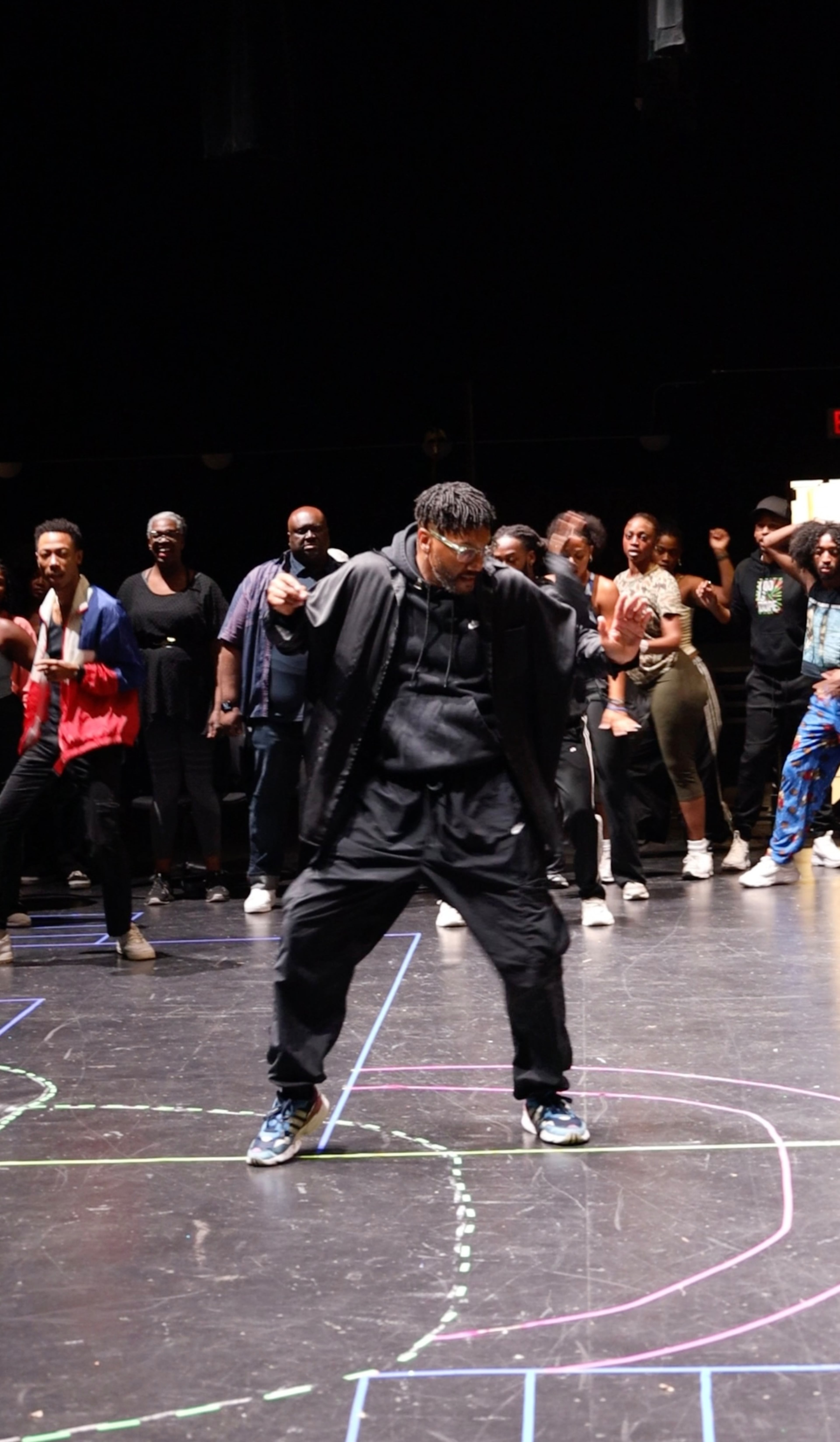 Still a dancer, Juel D. Lane, director of "Cinderella," shows off some of his moves to the cast and crew of the upcoming musical. (Courtesy of True Colors Theatre Company)